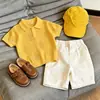 Ropa Infantil Coreana 2026 Verano Nuevo Estilo Amarillo Hueco Hoja Cuello Polo de Punto Manga Corta Infantil Casual Shorts Modernos
