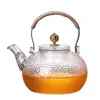Tetera de vidrio de borosilicato alto a prueba de explosiones a alta temperatura patrón martillado transparente cafetera casera asa de cobre asa asa viga olla juego de té al por mayor