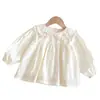 Camisa Coreana para Niña 2026 Nuevo Otoño Bebé Niña Lindo Bordado de Moño Encaje Cuello de Muñeca Top Moderno