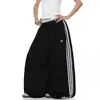 Pantalones de chándal deportivos de retazos a rayas para mujer y hombre, pantalones de baile holgados de pierna ancha para otoño, pantalones versátiles y adelgazantes de largo completo