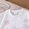 Traje de verano para niñas de estilo extranjero con camiseta de manga corta y falda plisada rosa, disponible en AliExpress entre Europa y Estados Unidos.