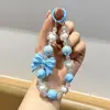 Nova corrente de celular com laço de miçangas inspirada na dopamina, um acessório fofo e estiloso para bolsas, e um chaveiro de carro doce e legal para meninas