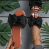 Nuevas sandalias planas de tiras con lazo de pedrería transfronterizas para mujer, sandalias de tela ligera de color liso para uso en exteriores, Amazon
