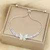 Pulsera de Mariposa de Doble Capa con Incrustaciones de Circonita, Estilo Ins, de Venta Cruzada, Ajustable y Retráctil, con un Diseño de Lujo Discreto de Nicho, de Luo Chen
