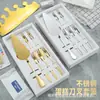 Juego de vajilla de acero inoxidable para hornear combinación siete en uno cuchillo y tenedor de pastel de cumpleaños de alta gama plato sombrero con logotipo