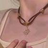 Colar Maillard de cordão de couro com estrela e sol de camada dupla, vintage, Spice Girl, personalidade, nicho, corrente de suéter superior