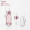 Botella de vidrio rosa translúcido muy atractiva para aceites esenciales, botella con gotero para suero y loción, botella dispensadora de productos cosméticos y para el cuidado de la piel