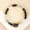 Pulseira Pixiu de Obsidiana Dourada Natural com Design Original, Apresentando Pedra da Lua Cinza, Cristal Branco e Contas de Concha para uma Composição Elegante de Contas