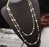 Colección Larga de Collares Superpuestos de Perlas Swarovski para Mujer, Estilo Lujo Ligero, Cadena Versátil para Suéter con un Toque de Alta Gama, Venta al por Mayor Otoño e Invierno