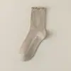 Calcetines de felpa para niñas Otoño Invierno Blancos Sin costuras de media pantorrilla Volante Doble aguja Calcetines largos Mocasines Calcetines de moda Venta al por mayor