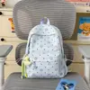 Mochila escolar de nuevo estilo para niñas, moderna y elegante, mochila de estrella pequeña, mochila de estilo coreano de gran capacidad para estudiantes de primaria y secundaria