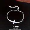 Pulsera de cordón con colgante de cruz de circonita, sensación de lujo ligero de alta gama, diseño de nicho a la moda, accesorio de mano único