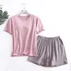 Una generación de primavera verano para mujer con almohadilla en el pecho, algodón de porcelana helada, manga corta, pantalones cortos, pijama holgado, traje de ropa para casa de color liso
