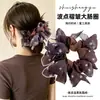 Goma de pelo retro de leopardo extragrande para otoño e invierno para mujer, scrunchie esponjoso estilo falda, nueva liga elástica para el pelo 2026, accesorio para el pelo