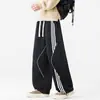 Calça casual masculina com três listras, nova coleção primavera/outono 2026, perna larga, corte reto, calça de moletom, um estilo popular este ano, calça de modelagem solta
