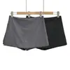 26111-26 Calça culotte versátil e confortável de outono estilo de rua, saia curta plissada em A com zíper lateral