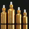 Botella de aceite esencial con galvanoplastia de oro, subbotella cosmética, botella de spray, botella de vidrio prensado, botella de loción crema a prueba de luz