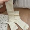 Medias de lana de oveja de seda de morera enrollada IOULOR para mujer otoño e invierno miu viento color sólido calcetines de rizo calcetines japoneses sin costuras