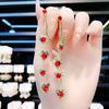 Pendientes de plata s925 con aguja multiusos de cristal rojo, encantadores, para mujer, con borlas de corazón de melocotón y temperamento rojo, pendientes adelgazantes.