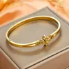 Nuevo brazalete de acero inoxidable con diseño de trébol de cuatro hojas calado, moda transfronteriza, flor de cuatro hojas que no se decolora, joyería de brazalete de acero de titanio