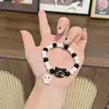 Pulsera de Cuerda Tejida con Gato Calavera de Venta Caliente para Mujeres Diseño de Nicho Dulce Fresco Estilo Chino Borlas Pulsera de Cuentas de Colores Joyería de Mano