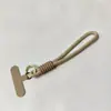 Llavero de cordón para teléfono móvil a juego de colores simple corto universal creativo adornos tejidos a mano cuerda anti-pérdida para altavoz de hervidor