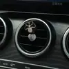 Aromaterapia para Coche Salida de Aire Acondicionado Decoraciones Decoración Perfume Suministros para el Interior del Coche Flores de Cinco Pétalos Cruz de Metal Transfronterizo
