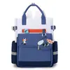 Mochila escolar para alunos do ensino fundamental, mochila de costas dupla, mochila de mão, novo estilo transfronteiriço, leve, à prova d'água, grande capacidade, para ir à aula, reforço escolar, atacado