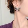 Pendientes de mariposa grandes y lisos con personalidad transfronteriza para mujer, chapados en oro real de 18 quilates, estilo exagerado, joyería de nicho de alta gama al por mayor