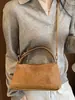 Bolsa casual de nicho para mulheres, novidade outono de 2026, bolsa transversal vintage de cor sólida, bolsa de ombro e de axila personalizada para o dia a dia