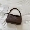 Bolsa de mano tejida para mujer Shuai Mi Jia Modelo Nuevo 2026 Color Sólido Personalidad Vintage Bolso de mano de moda para ir al trabajo Bolso de axila
