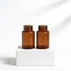 Garrafa de vidro marrom de boca larga de fábrica, frasco dispensador de cápsulas e comprimidos à prova de luz, frasco de vidro medicinal com tampa de alumínio, pode ser impresso