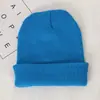 Tablero de luz de color sólido sombrero de lana acrílica Amazon para hombres y mujeres pareja europeo y americano otoño e invierno tejido sombrero pullover blanco y negro
