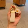 Chaveiro de Couro Minimalista para Carro Estilo Francês, Pingente de Chave Simples e Fofo, Mesmo Estilo do Xiaohongshu, Pingente de Girassol