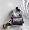 Mochila Moderna Genial para Hombre Estilo Coreano Simple Estudiante de Secundaria Ligera Doble Correa para el Hombro para Mujer Gradiente Gran Capacidad Alta Calidad Duradera Estudiante Universitario