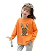 Camiseta base de algodón puro con estampado de dibujos animados para niños, top de moda, nuevo estilo primavera y otoño 2026, camiseta elegante de manga larga para niñas