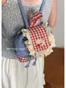 Mochila de mezclilla coreana linda de moda transfronteriza para mujer 2025 Nueva bolsa de cubo portátil de encaje a cuadros