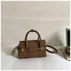 Bolso de hombro elegante, versátil y minimalista, perfecto para la primavera de 2026, con un diseño de color liso y forma cuadrada pequeña