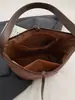 Bolso tipo cubo de estilo casual perezoso de alto valor 2026 Otoño Nuevo Elegante Sensación Relajada Color Sólido Gran Capacidad Bolso de Hombro