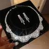 Aretes y collar de dos piezas con colgante de flor y gota de agua incrustados con diamantes, cadena para la clavícula de moda y exquisita, joyería de lujo ligero y de alta gama para mujer
