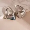 Pendientes geométricos de metal con diseño de aguja plateada, irregulares, estilo viento, moda transfronteriza europea y americana, pendientes de lujo ligero de alta gama para mujer