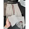Pantalones deportivos de estilo americano con bloques de color para hombre, pantalones rectos holgados de alta gama nuevos, pantalones casuales modernos y versátiles