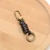 Llavero tejido a mano de fábrica hebilla de puerta accesorios cuerda de cuero versátil retro accesorios de colgante semiacabados para DIY