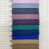 En stock, tela a cuadros blanca de nailon-poliéster de 0,25 denier, suave y amigable con la piel, tela a cuadros teñida de nailon clásica y moderna para pantalones