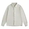 Camisa masculina de malha texturizada bege claro com lapela, manga longa, cor sólida, abotoamento simples, modelagem solta, macia, casual, para trabalho