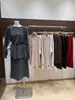 Suéter de punto de estilo perezoso de longitud media con mangas largas para mujer 2026 nuevo invierno suelto elegante top para llevar debajo