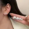Brincos de Pérola Tipo Pão Chinês Retro Francês Design de Nicho para Mulheres Sentido de Design Luxo Leve de Ponta Ornamentos de Orelha Exagerados Brincos Simples para o Dia a Dia