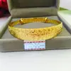 Pulsera de latón chapada en oro al por mayor puesto de joyería de imitación de oro suministro de entidad fábrica empuje-tirón directo Pulsera de Estrella