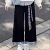 Nova coleção de primavera e outono para meninas: um conjunto de duas peças moderno com um top de gola, com design de patchwork que imita duas peças, combinado com calças xadrez simples e casuais em cores contrastantes
