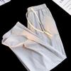 Pantalones casuales de hombre de moda, tubo recto, holgados, de verano, finos, de seda de hielo, pantalones deportivos, pantalones de tiro bajo, una generación de cabello